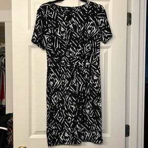 Black and white fit and flare work dress.